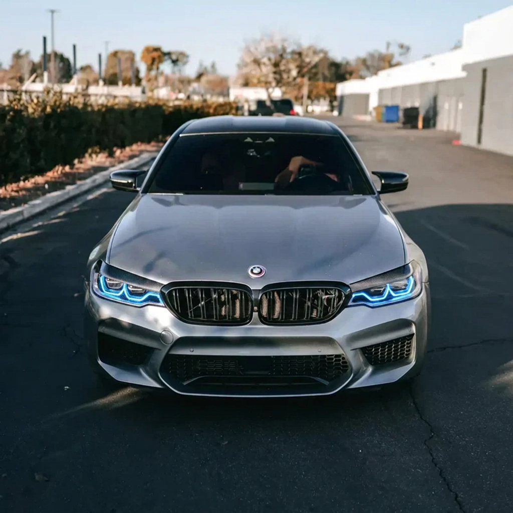 BMW F90 M5 with blue DRL kit installed - front view