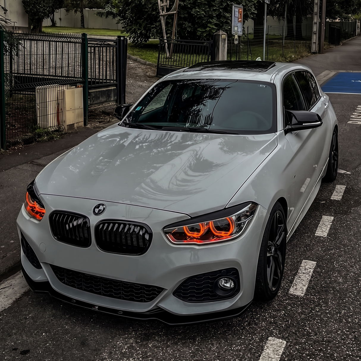 BMW F20 1 Series LCI with red DRL kit installed