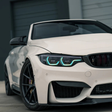 BMW F82 M4 with RGB DRL kit showing purple and cyan