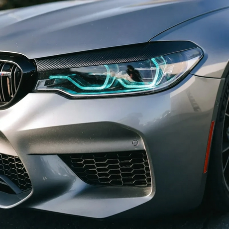 BMW F90 M5 ice blue DRL headlight close up