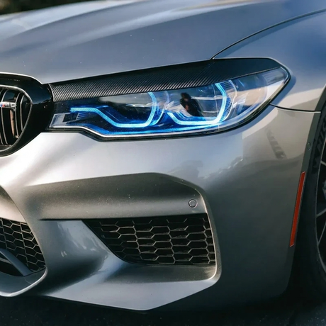 BMW F90 M5 blue DRL headlight close up