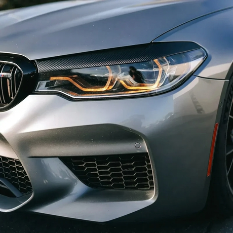 BMW F90 M5 amber DRL headlight close up