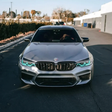 BMW F90 M5 with ice blue DRL kit installed - front view