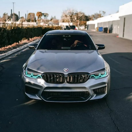 BMW F90 M5 with ice blue DRL kit installed - front view