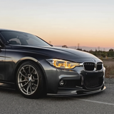 BMW F30 3 Series amber DRL three quarter view at sunset